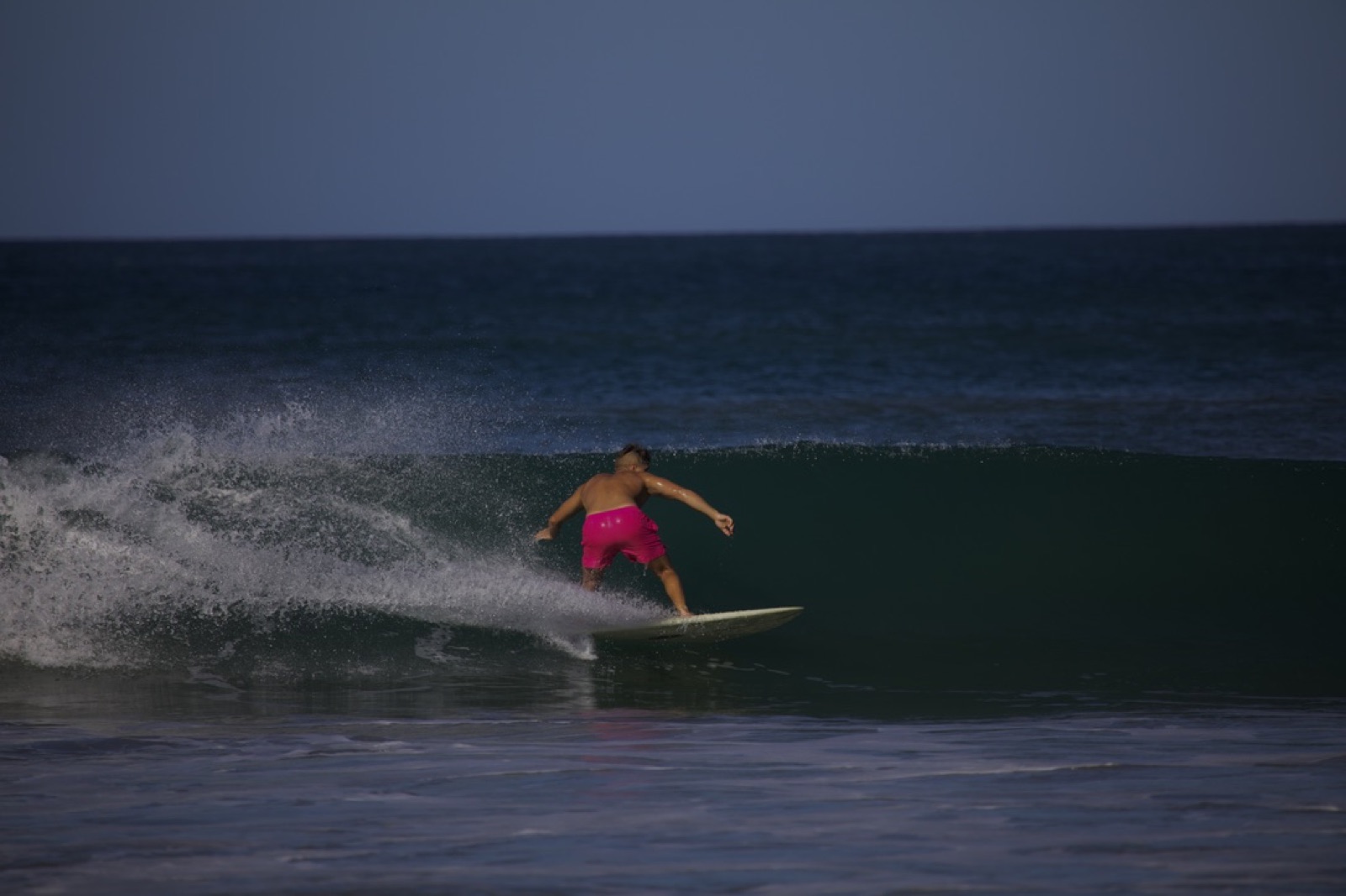 Surfing the beach break at Tamarindo