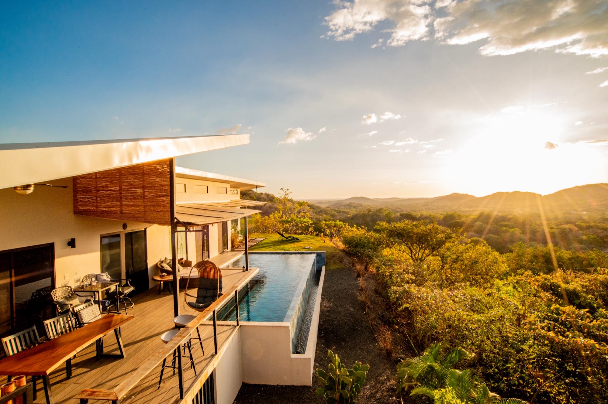 Casa Toltec and its infinity pool at sunset, overlooking the valley