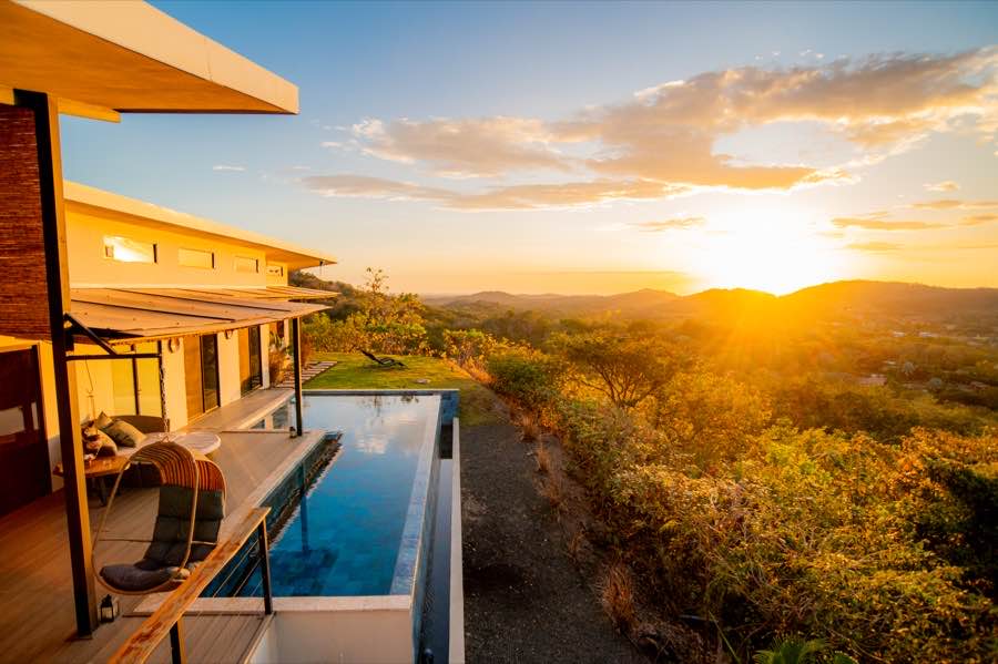 Casa Toltec's infinity-edge pool at sunset, the valley falling away beyond the rim