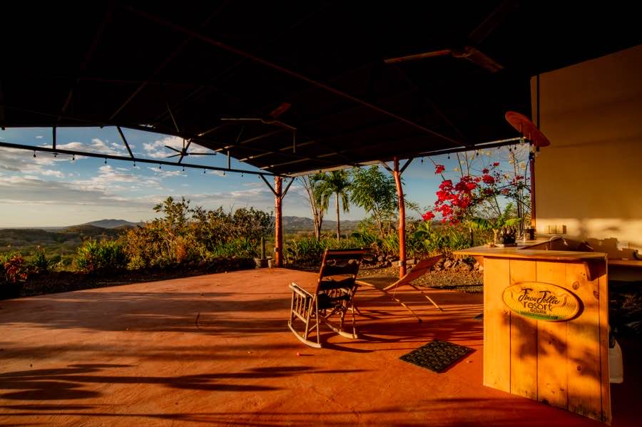 The Yoga Studio floor in golden-hour light, open to the valley on every side