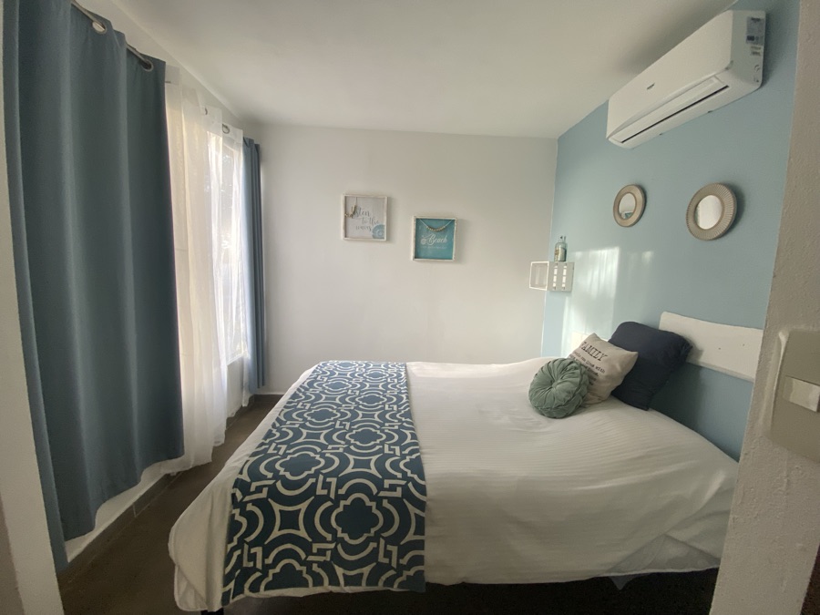 The bedroom at Casa Luna, with air conditioning and blackout curtains